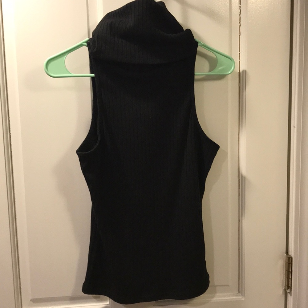 Sleeveless black turtle neck